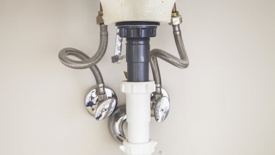 Plumbing under a sink